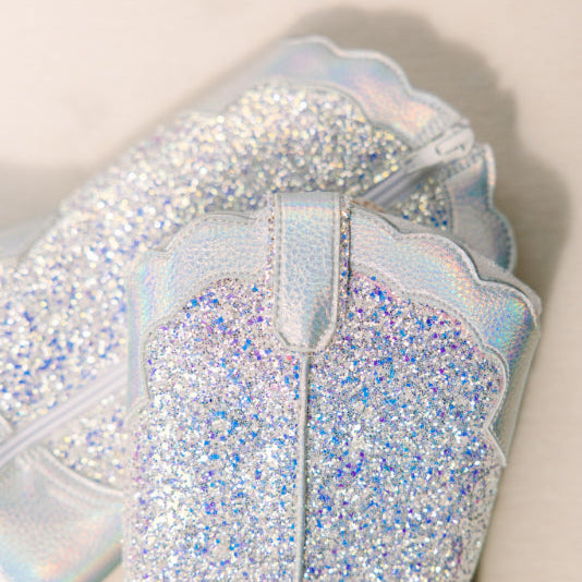 Iridescent glittery boot design on a neutral background