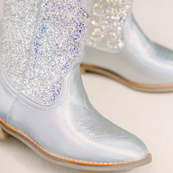 Silver glittery boots on a light background