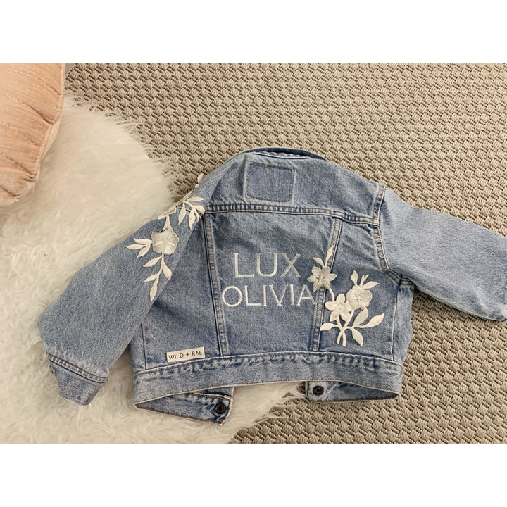Custom jean jacket with embroidered Lux Olivia written on it